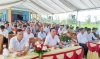 Đông đảo người dân thôn Vinh Phú dự lễ công bố thôn đạt chuẩn NTM kiểu mẫu. Ảnh: H.NĂM - M.TÂN